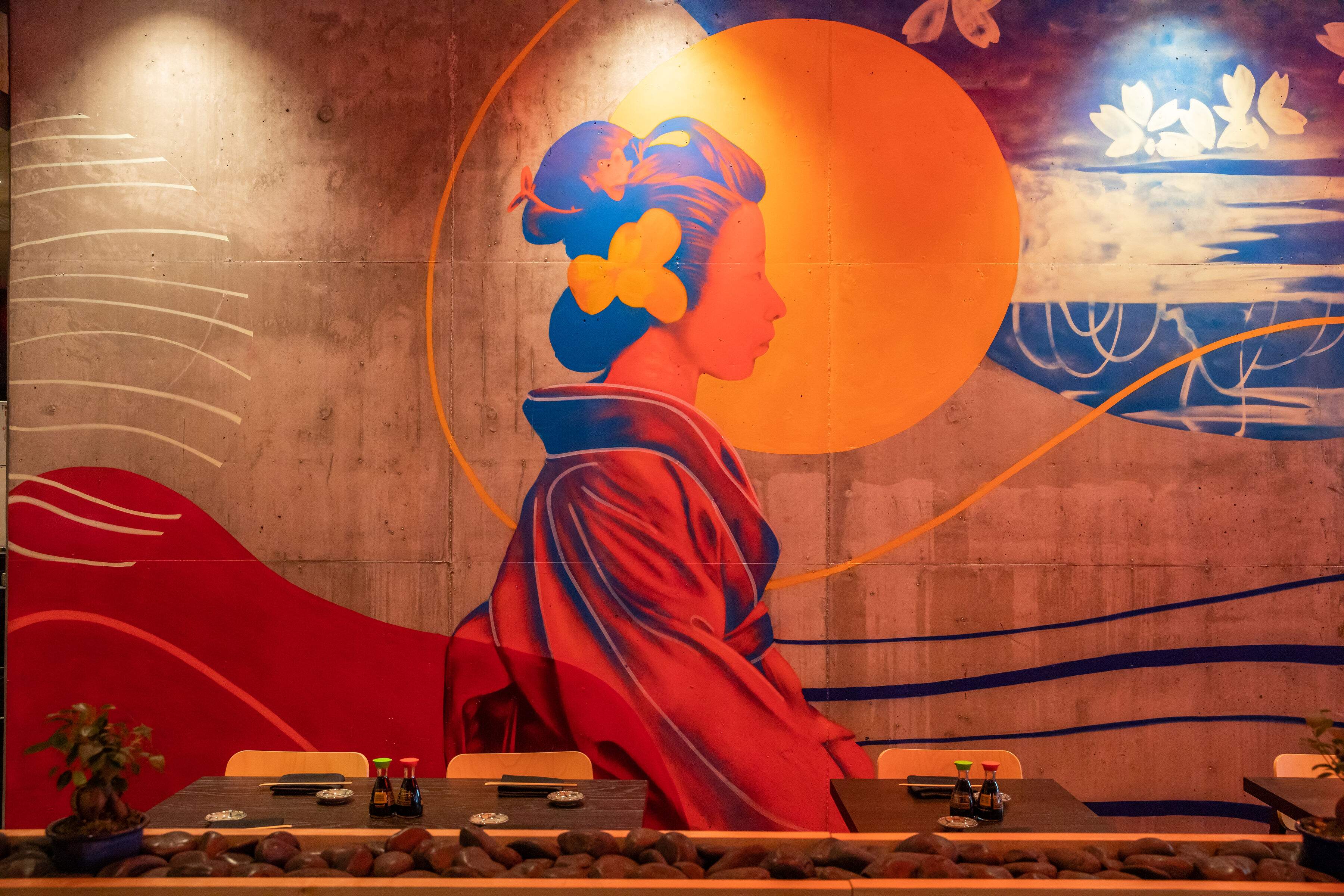A mural on the wall of a Japanese woman.