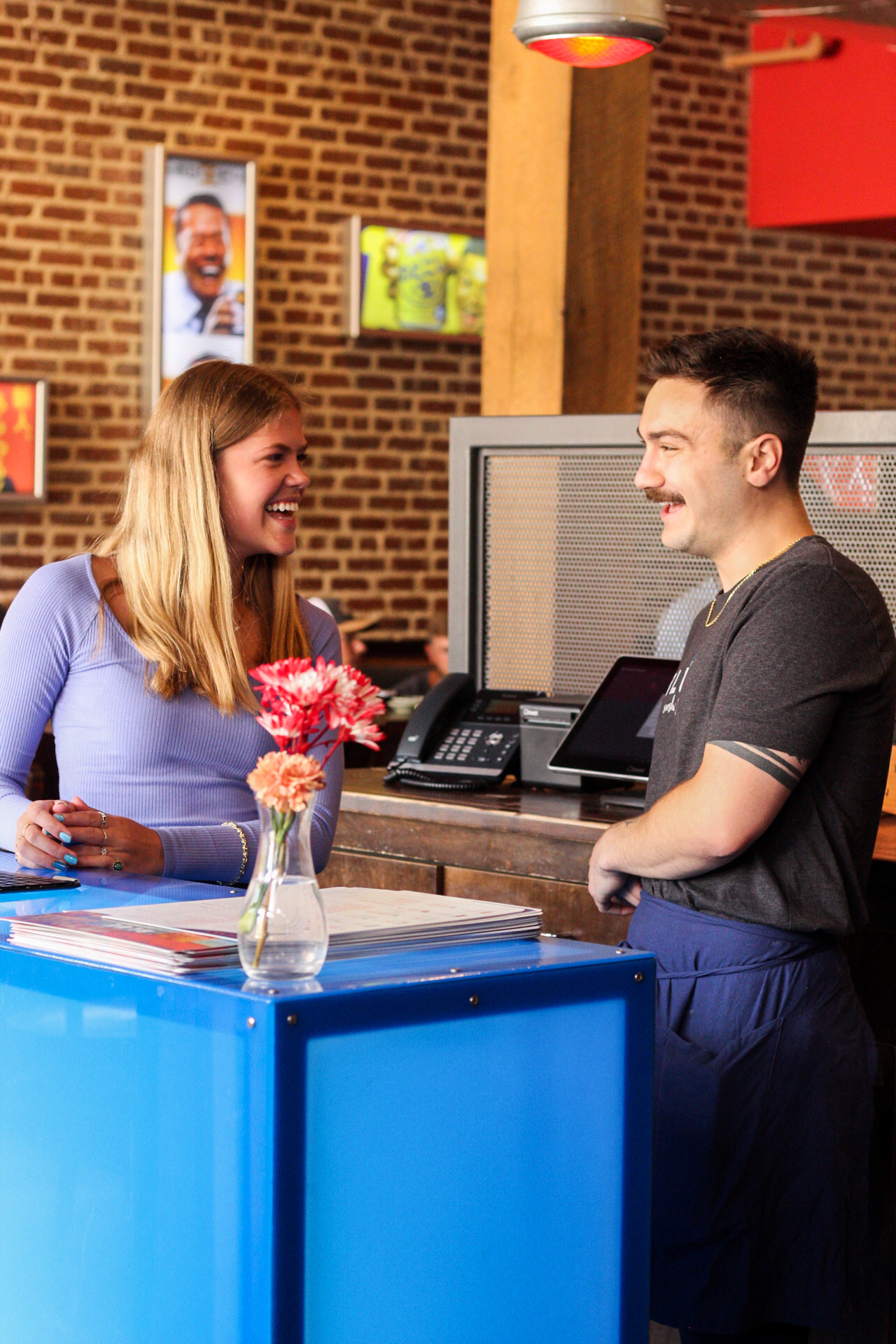 Employees having a fun time working at Blue Sushi Sake Grill. 