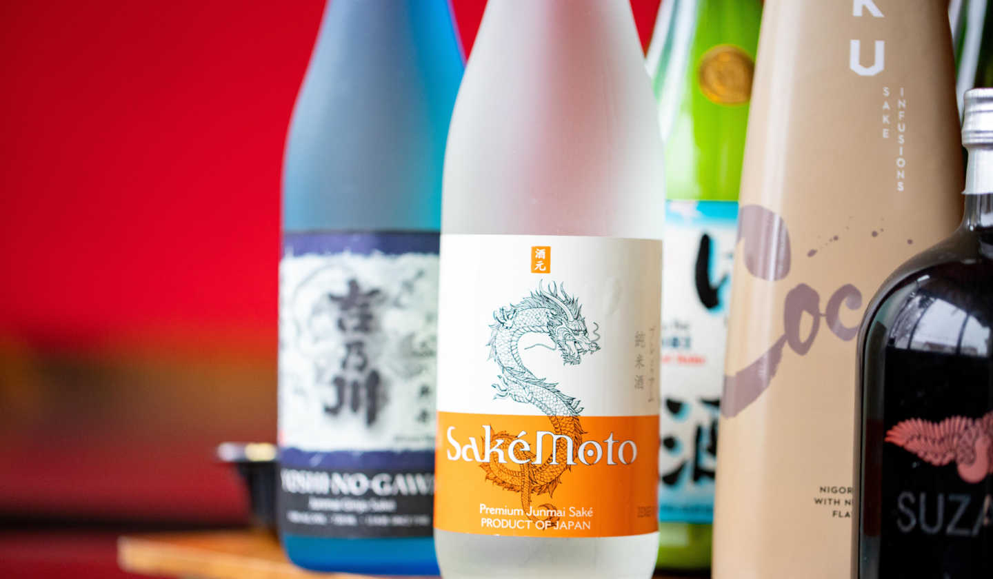A lineup of various alcohol bottles, including sake bottles, showcasing a diverse range of choices. Cheers! 🍾🥃🍷